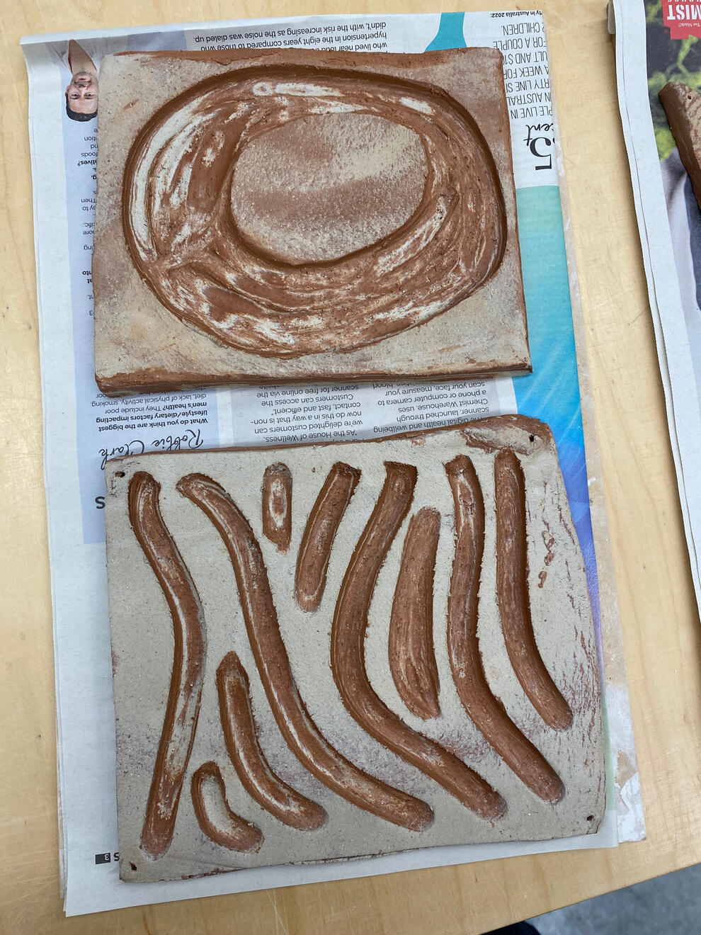 Mixing red and white clay bodies and carving back to show the layers between them